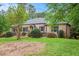 Charming one-story brick home with manicured lawn, mature trees, and lush landscaping creating a welcoming curb appeal at 2790 Westhampton Way, Tucker, GA 30084