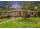 Charming brick home with well-manicured lawn and garden in a beautiful setting, with a welcoming front entrance at 2790 Westhampton Way, Tucker, GA 30084