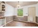 Corner kitchen area with natural lighting from backyard door and a tile floor at 2790 Westhampton Way, Tucker, GA 30084