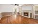 Bright living room with hardwood floors, fireplace, ceiling fan, and neutral colors at 2790 Westhampton Way, Tucker, GA 30084