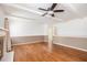 Spacious living room with a fireplace, ceiling fan, hardwood floors and neutral color walls at 2790 Westhampton Way, Tucker, GA 30084