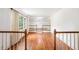 Hardwood flooring, white walls, and large windows create a light and spacious living area at 2790 Westhampton Way, Tucker, GA 30084