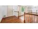 Hardwood flooring, white walls, and large windows create a light and spacious living area at 2790 Westhampton Way, Tucker, GA 30084