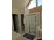 Bathroom featuring a glass-enclosed shower, white tile, and natural light at 4299 Sherwood Oaks Dr, Decatur, GA 30034