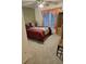 Comfortable bedroom with a ceiling fan, carpet, and natural light from a large window at 4299 Sherwood Oaks Dr, Decatur, GA 30034