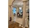 Dining room with tile flooring, complemented by large windows and decorative columns at 4299 Sherwood Oaks Dr, Decatur, GA 30034