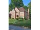 Charming home with well-manicured lawn and traditional architectural details at 4299 Sherwood Oaks Dr, Decatur, GA 30034