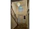 Foyer with high ceilings and a chandelier, seen from the staircase landing at 4299 Sherwood Oaks Dr, Decatur, GA 30034