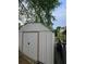 Metal shed with double doors; exterior view showing trailer at 4299 Sherwood Oaks Dr, Decatur, GA 30034
