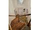 Staircase with a wood handrail and white balusters, offering a view of the light-filled foyer below at 4299 Sherwood Oaks Dr, Decatur, GA 30034