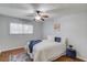 Bedroom featuring a ceiling fan, hardwood floors and a colorful rug at 1728 Hudson Rd, Decatur, GA 30033
