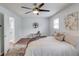 This bedroom features hardwood floors, a ceiling fan, and white walls at 1728 Hudson Rd, Decatur, GA 30033