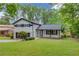 Inviting two-story house with a well-manicured lawn and a cozy front porch at 1728 Hudson Rd, Decatur, GA 30033