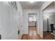 Bright foyer with hardwood floors and an open view to the kitchen and living room at 1728 Hudson Rd, Decatur, GA 30033