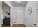 Clean, bright foyer with hardwood flooring and decorative accents on display at 1728 Hudson Rd, Decatur, GA 30033