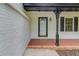 Welcoming front porch with tiled flooring and decorative support columns at 1728 Hudson Rd, Decatur, GA 30033