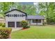 Charming two-story home with a well-maintained lawn and a two-car garage at 1728 Hudson Rd, Decatur, GA 30033