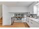 Open concept kitchen featuring white cabinets and stainless steel appliances at 1728 Hudson Rd, Decatur, GA 30033