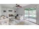 A living room featuring a brick fireplace and a view into an enclosed porch at 1728 Hudson Rd, Decatur, GA 30033
