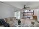 Cozy living room featuring neutral decor, plush seating, and a view to a screened porch at 1728 Hudson Rd, Decatur, GA 30033