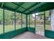 The enclosed porch overlooks a large fenced backyard at 1728 Hudson Rd, Decatur, GA 30033