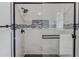 A beautifully tiled shower stall featuring black trim and a mosaic tile inset at 1728 Hudson Rd, Decatur, GA 30033