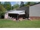 Backyard featuring a screened-in porch with outdoor furniture for relaxing or entertaining at 3215 Hembry Ct, Marietta, GA 30062