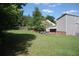 Expansive backyard featuring a patio area and mature trees, ideal for outdoor activities and relaxation at 3215 Hembry Ct, Marietta, GA 30062