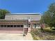 Charming two-story home with brick and vinyl siding, plus a pink two-car garage on a sunny day at 3215 Hembry Ct, Marietta, GA 30062