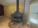 Living room with indoor fireplace on raised hearth with tile floors and picture window at 3215 Hembry Ct, Marietta, GA 30062