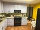 Kitchen featuring stainless steel oven and range with exhaust hood, and tile floors and backsplash at 3215 Hembry Ct, Marietta, GA 30062