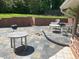 Spacious outdoor patio with tile flooring, brick accents, and furniture, ideal for relaxing and entertaining at 3215 Hembry Ct, Marietta, GA 30062