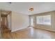 Sun-filled living room with hardwood floors, light walls, and a welcoming front door view at 80 Crystal River Dr, Riverdale, GA 30274