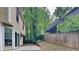 Cozy backyard with a wood fence and trees at 829 Longfellow Ct, Stone Mountain, GA 30088
