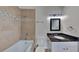 Bright main bathroom with a soaking tub, tiled shower, and a stylish vanity, creating a relaxing and functional space at 829 Longfellow Ct, Stone Mountain, GA 30088