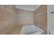 Elegant main bathroom showcasing a soaking tub with tiled walls, and a modern vanity for a spa-like experience at 829 Longfellow Ct, Stone Mountain, GA 30088