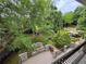 Lush backyard featuring a playground, pond with gazebo, and mature landscaping at 2038 Lee Se Rd, Smyrna, GA 30080