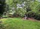 Lush backyard with a playset, perfect for outdoor activities at 2038 Lee Se Rd, Smyrna, GA 30080
