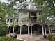 Expansive backyard featuring balconies and a covered patio with seating at 2038 Lee Se Rd, Smyrna, GA 30080