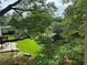 Picturesque backyard with lush greenery, a gazebo, and serene landscaping at 2038 Lee Se Rd, Smyrna, GA 30080