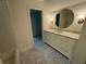 Bright bathroom featuring a marble countertop vanity, and hexagon tile flooring at 2038 Lee Se Rd, Smyrna, GA 30080