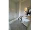 Bathroom with white subway tile, marble countertop vanity and grey hexagon tile flooring at 2038 Lee Se Rd, Smyrna, GA 30080