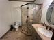 Bathroom featuring a glass enclosed shower with designer tile work at 2038 Lee Se Rd, Smyrna, GA 30080