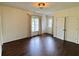 Bedroom featuring hardwood flooring, neutral walls, windows, and a closet at 2038 Lee Se Rd, Smyrna, GA 30080