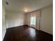 Bedroom featuring wainscoting, hardwood floors, and natural light at 2038 Lee Se Rd, Smyrna, GA 30080
