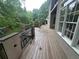 Deck with decorative iron railings overlooking lush greenery and backyard at 2038 Lee Se Rd, Smyrna, GA 30080