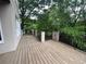Expansive deck with iron railings and decorative pillars overlooking the yard at 2038 Lee Se Rd, Smyrna, GA 30080