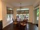 Dining area with wood floors and a round table with seating at 2038 Lee Se Rd, Smyrna, GA 30080