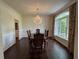 Dining room with hardwood floors, a chandelier and a view to the backyard at 2038 Lee Se Rd, Smyrna, GA 30080