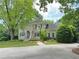 Elegant two-story home with a charming balcony and well-manicured lawn at 2038 Lee Se Rd, Smyrna, GA 30080